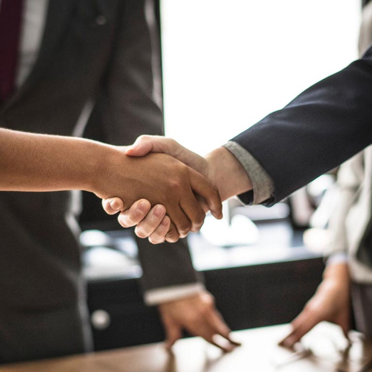 Close up of a handshake