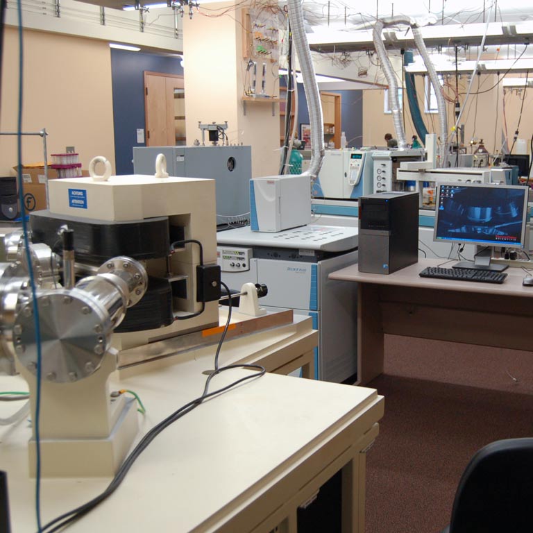 Lab space full of mechanical equipment and computers